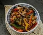 Creamy suya-infused penne pasta with chicken, peppers and onions. (5)